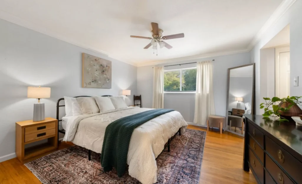 Airbnb bedroom with fresh light wall paint and staged décor in Chico, CA