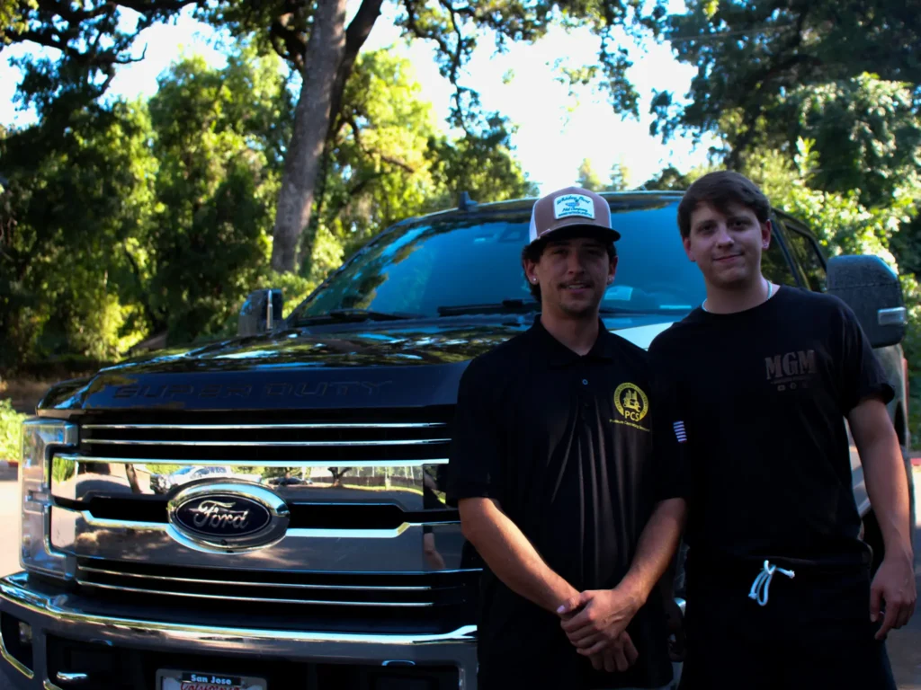Local painters in Chico standing in front of TC Painting work truck