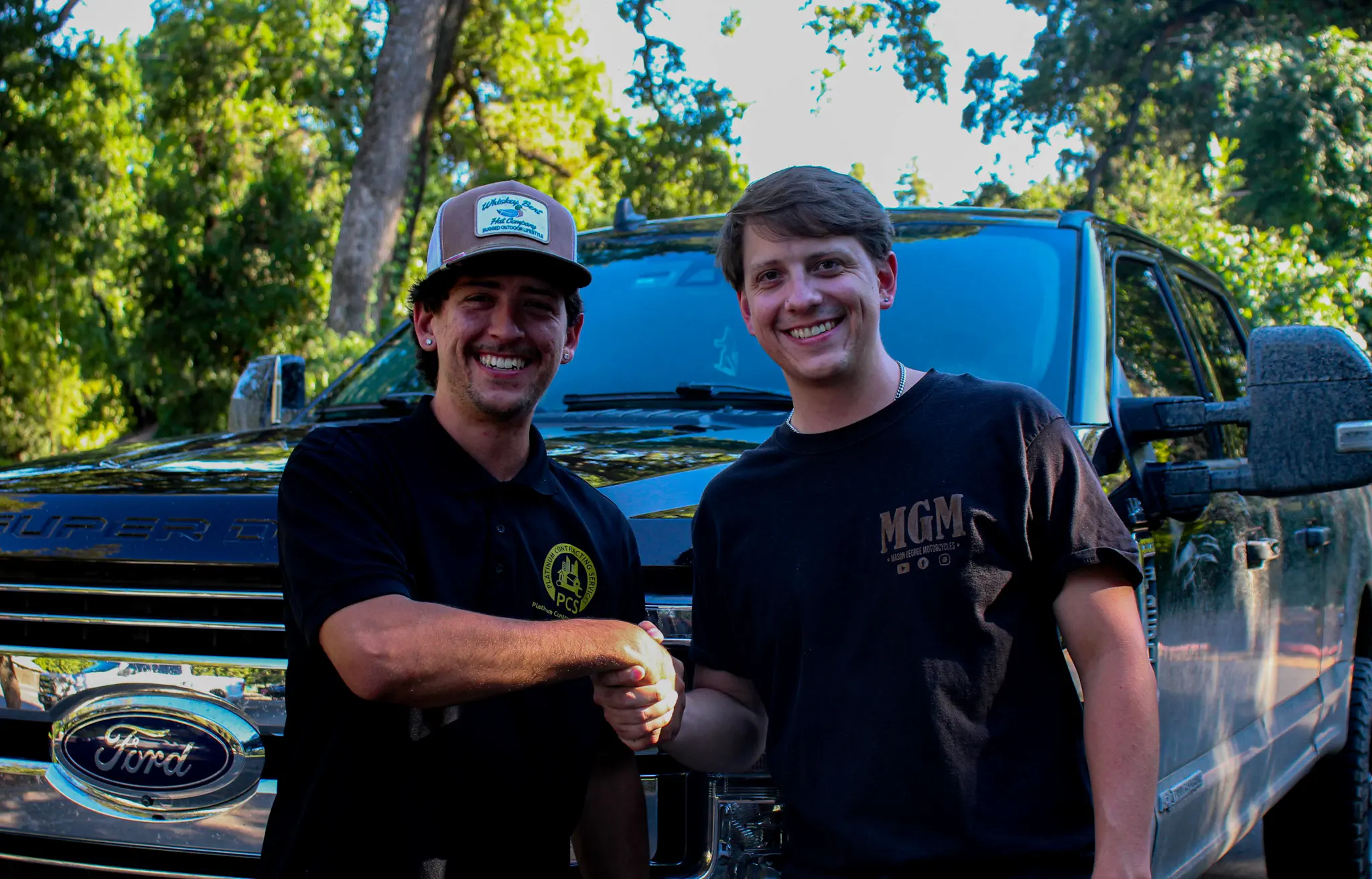 TC Painting team shaking hands in front of work truck in Chico